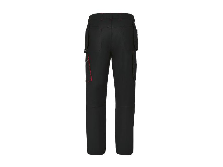Pantalon de travail noir avec poches latérales et coutures rouges.