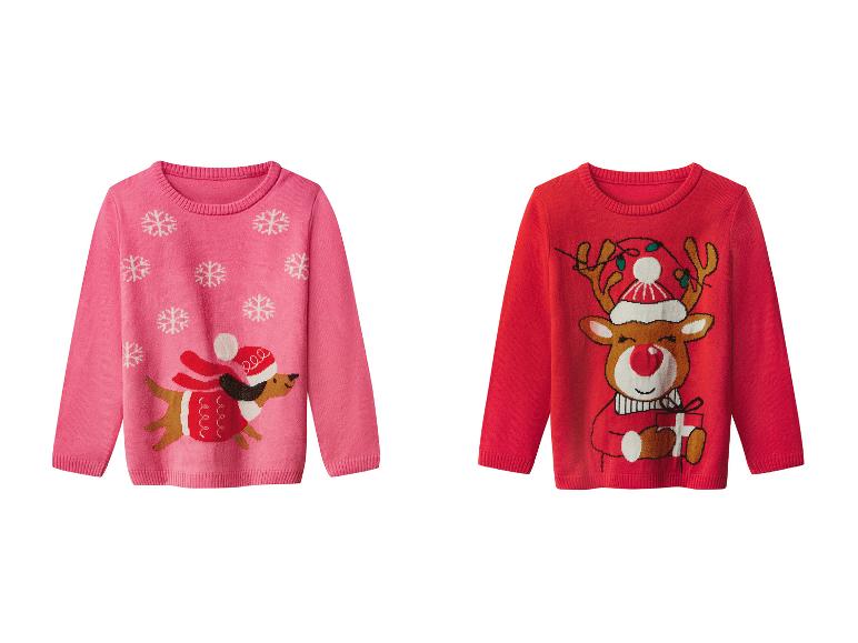Deux pulls de Noël pour enfants : un rose avec un teckel et un rouge avec un renne.