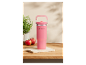 Un mug isotherme rose Silvercrest sur une surface en bois.