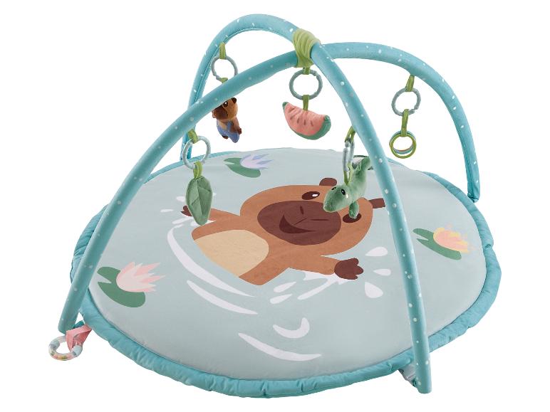 Tapis d'éveil bébé avec arches, jouets suspendus et motif de singe nageur.