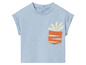 T-shirt bleu clair avec une poche orange et une plante
