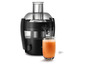 Un extracteur de jus Philips noir avec un verre de jus d'orange frais.