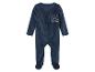 Une grenouillère bleu marine pour bébé avec un motif d'étoiles.