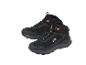 Paire de chaussures de randonnée noires imperméables avec des accents orange et des lacets réfléchissants