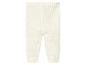 Pantalon en tricot blanc pour bébé.