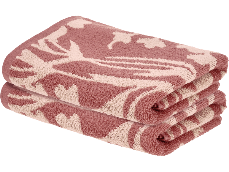 Deux serviettes pliées roses et blanches à motifs de feuilles tropicales.