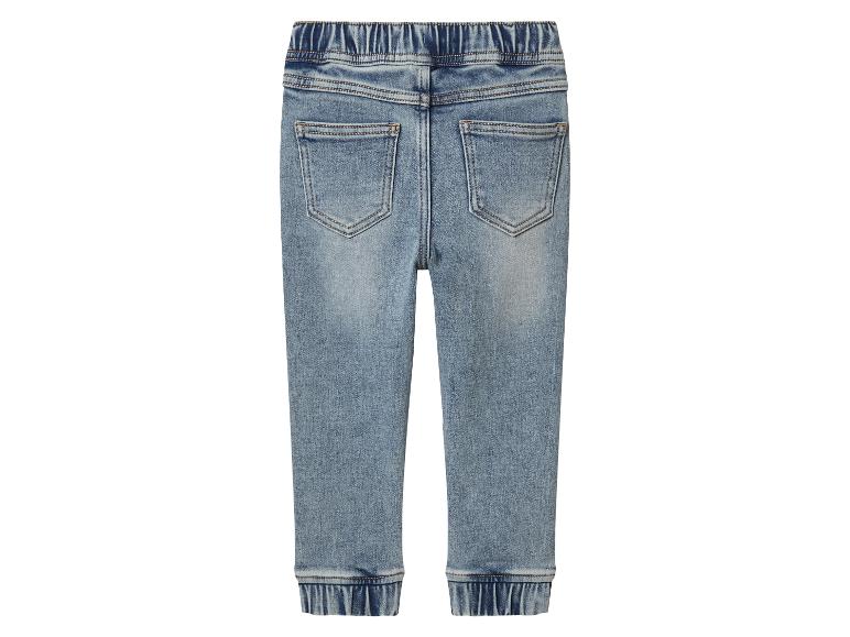 Dos d'un jean jogger bleu clair avec taille et chevilles élastiques