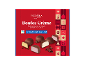 Boîte rouge de boules de crème au chocolat au lait, fourrées orange, framboise et vanille.