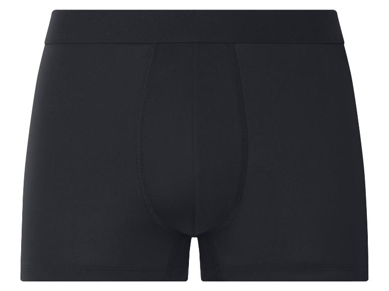 Boxer noir pour homme avec ceinture élastique et coutures apparentes.
