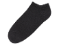Une chaussette noire de cheville isolée sur un fond noir.