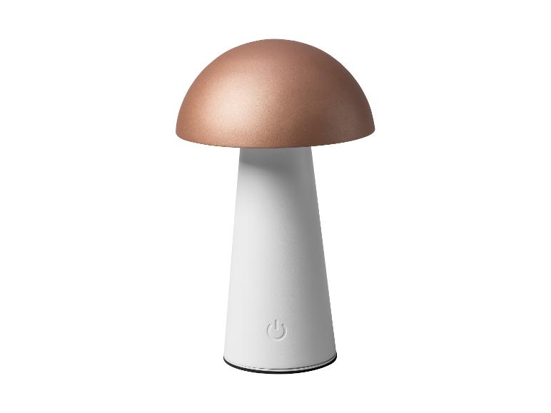 Lampe de table en forme de champignon avec un dessus en cuivre et une base blanche, avec bouton d'alimentation.