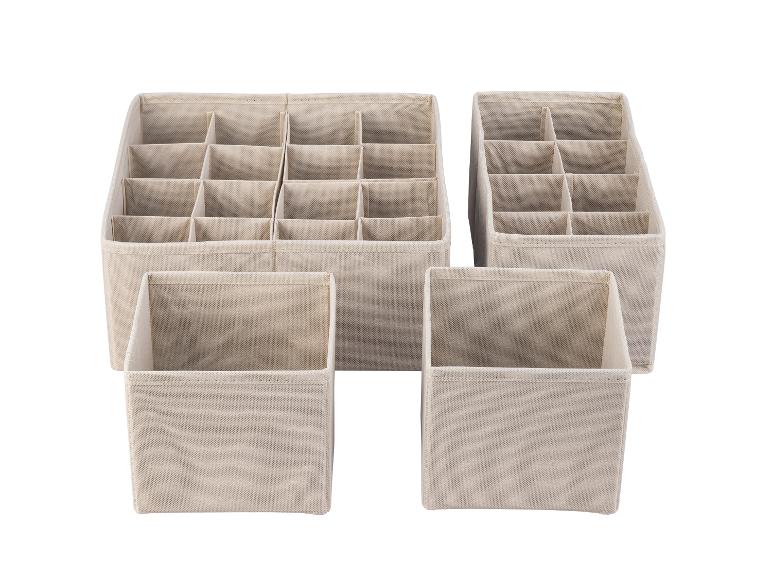 Boîtes de rangement beige à compartiments multiples pour tiroirs.