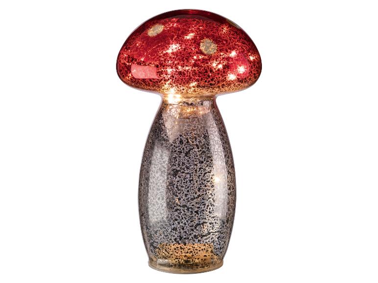 Lampe champignon rouge avec pied argenté moucheté.