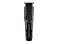 Tondeuse à cheveux et à barbe noire avec bouton d'alimentation et panneau noir brillant