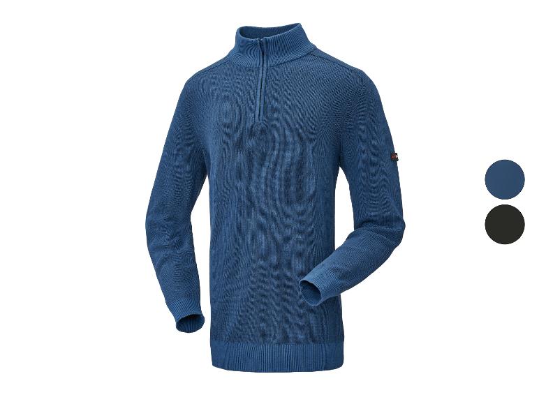 Pull en maille bleu pour homme avec fermeture éclair courte et col montant, avec une étiquette sur la manche.