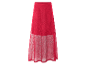 Jupe longue rouge en maille avec doublure en tulle.