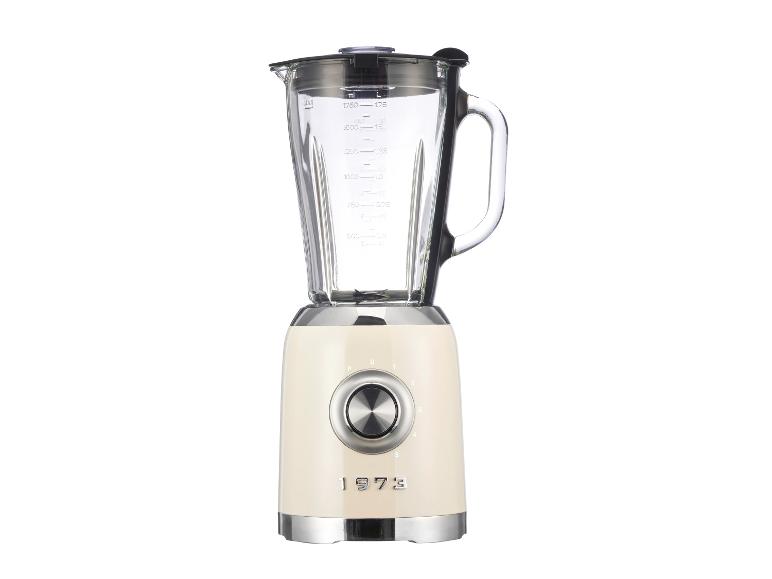 Un blender crème style années 1970 avec un bol en verre et un bouton rotatif.