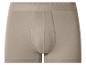 Caleçon boxer beige pour homme avec ceinture élastique.