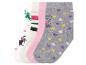 Quatre paires de chaussettes avec des motifs de cœurs, de rayures et de licorne.