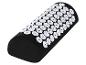 Coussin d'acupression noir avec picots blancs