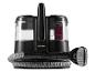 Un nettoyeur vapeur Cleanmaxx noir avec un tuyau et une brosse.