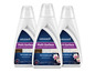 Trois bouteilles de solution nettoyante pour sols Bissell Multi-Surface pour le bois, les carreaux et les tapis.
