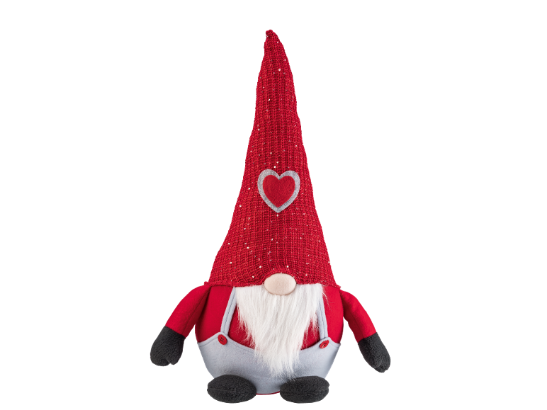 Gnome en peluche avec chapeau rouge, barbe et cœur, parfait pour la décoration festive.