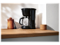 Cafetière Elokast sur un comptoir en bois.