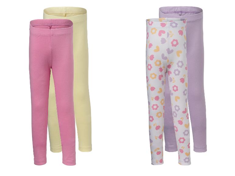 Deux paires de leggings pour enfants: rose et jaune, et blanc fleuri avec violet.