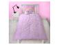 Lit d'enfant avec housse de couette et oreiller licorne et arc-en-ciel violet.