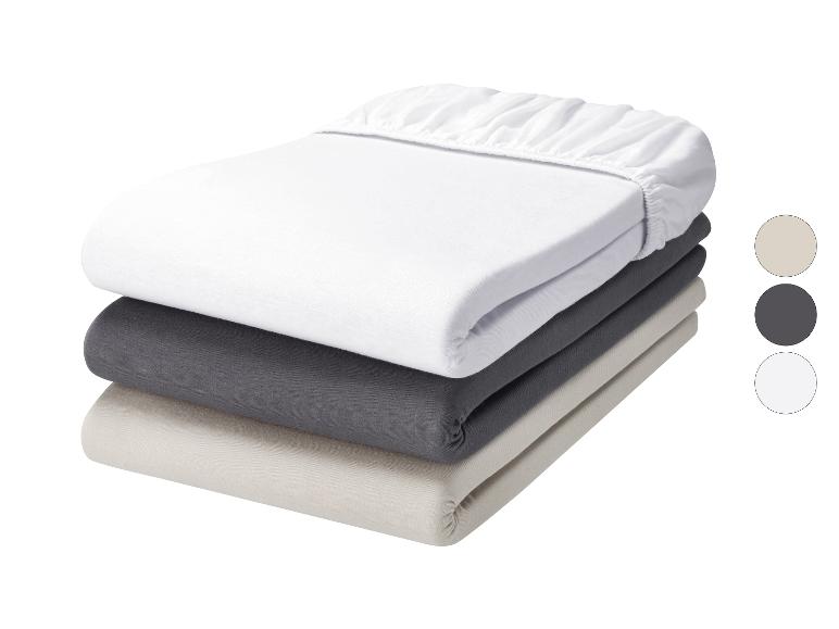 Lot de draps-housses en coton blanc, gris foncé et beige