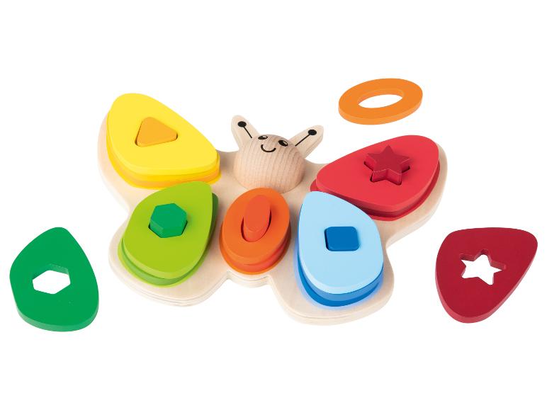 Jouet en bois avec puzzle en forme de papillon avec hexagone, carré, cercle et étoile.