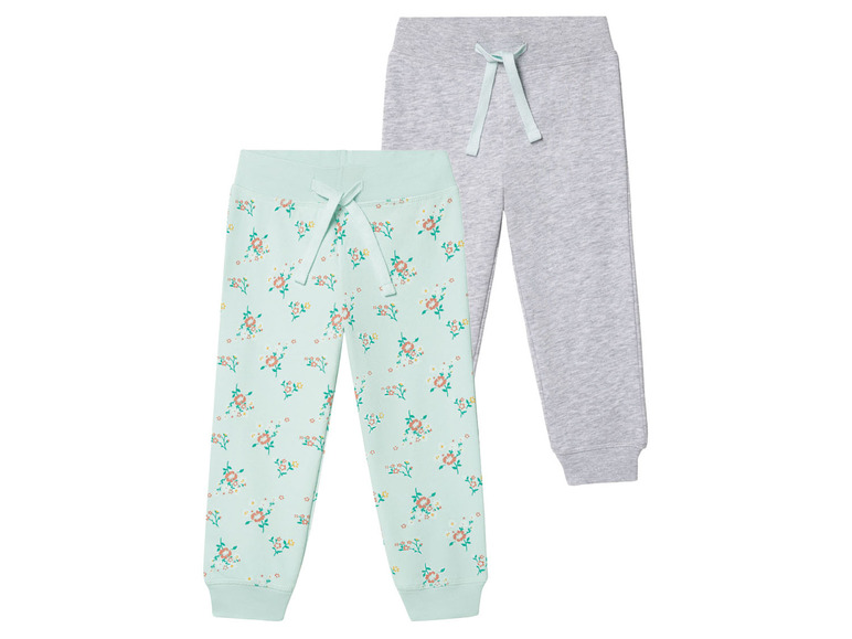 Deux pantalons, un à fleurs et un gris.