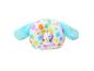 Un coussin pour chien en peluche blanche avec des pois multicolores et un petit chien