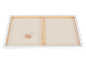 Dos d'une toile tendue sur un châssis en bois avec un sachet de clés en bois
