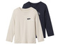 Deux t-shirts à manches longues pour garçons, un beige avec 'Make some noise' et un bleu marine avec 'The'.