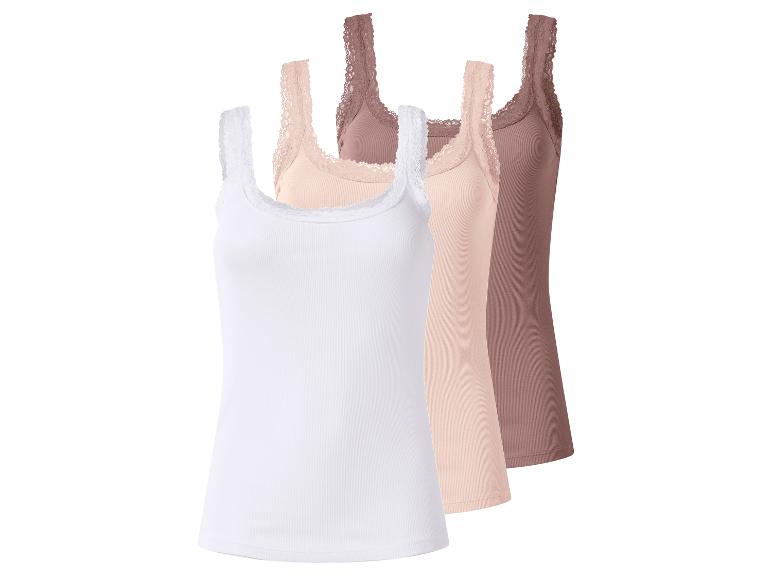 Lot de trois débardeurs femme en dentelle blancs, beiges et marron.