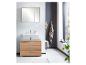 Meuble de salle de bain avec miroir et lavabo avec meuble en bois.