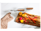 Couteaux de cuisine SilverCrest et légumes coupés sur une planche à découper en bois.