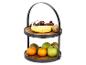 Corbeille à fruits à deux étages avec bananes, raisins, kiwis, mandarines, pommes et poires.