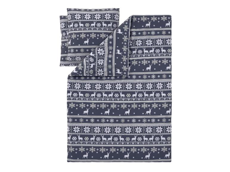 Parure de lit avec motif de rennes et de flocons de neige.