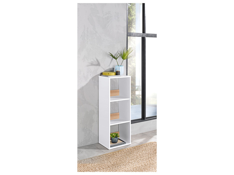 Étagère blanche avec trois étagères, dans un décor moderne.