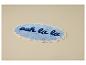 Tapis de bain ovale bleu avec le texte « ooh la la » et une bordure ondulée.