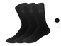 Trois paires de chaussettes noires avec un petit logo.