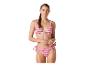 Femme en bikini rose et violet à motif zigzag avec bas à nouer.