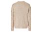Pull en maille beige avec un motif de torsades sur les manches.