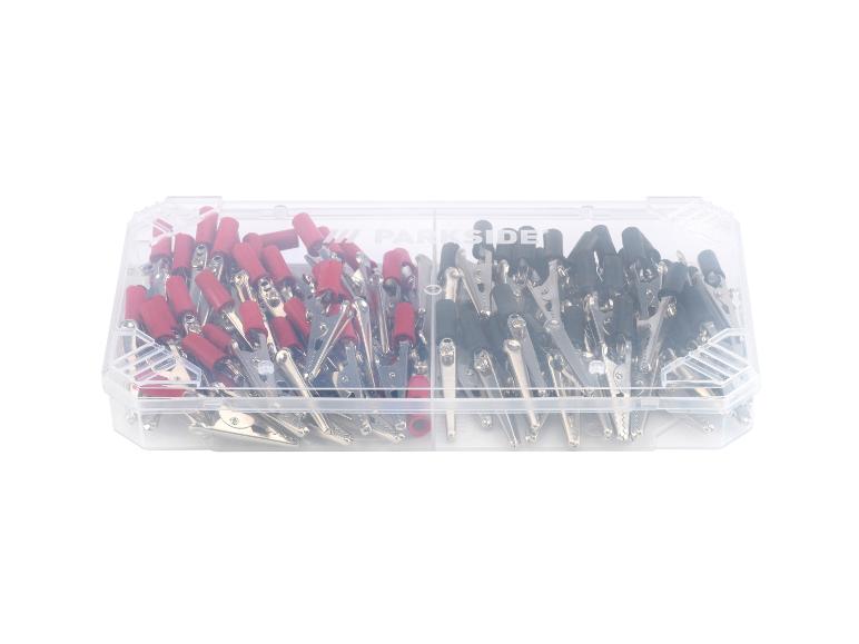 Crocs de connexion Parkside rouges et noirs dans un boîtier transparent.