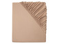 Un drap housse beige avec un élastique.
