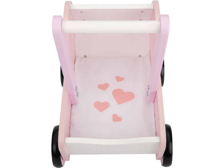 Chariot de marche en bois rose avec poignée blanche et base en tissu à motifs de cœurs.