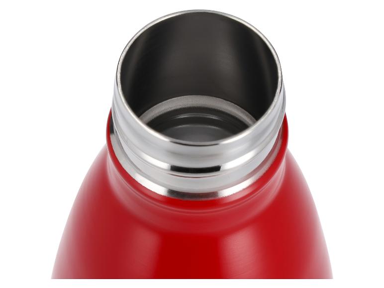 Bouteille isotherme rouge ouverte avec un bord et un intérieur métalliques.